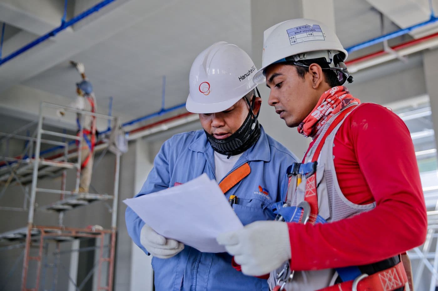 Engineers reviewing project plans on site