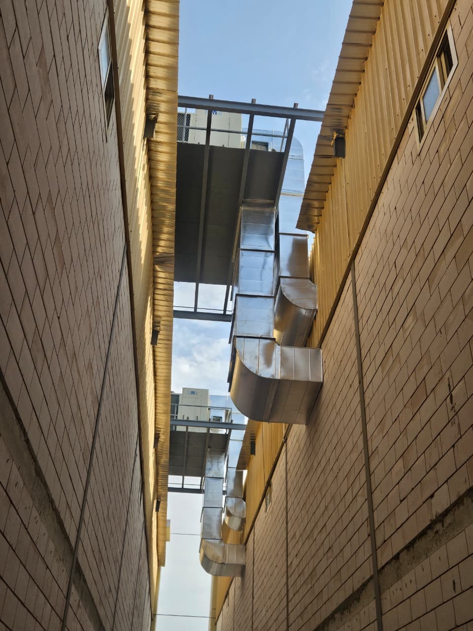 Exterior insulated ductwork run between buildings